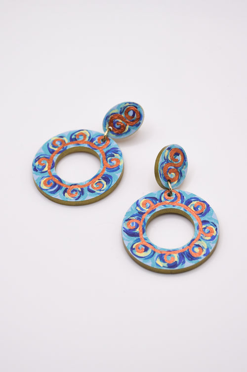 Pair of colorful hoop earrings on a white background